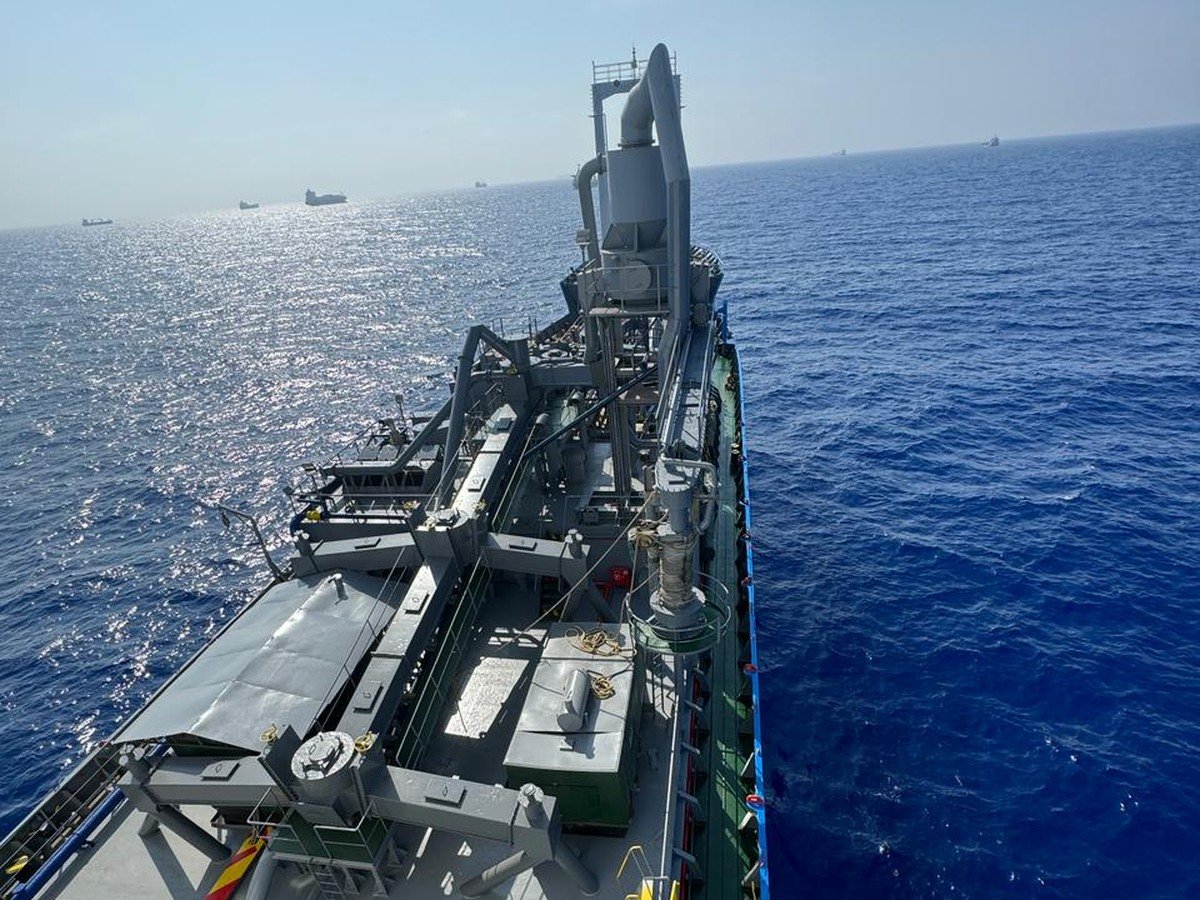 Elevated deck view of a vessel underway, part of a P&I condition survey